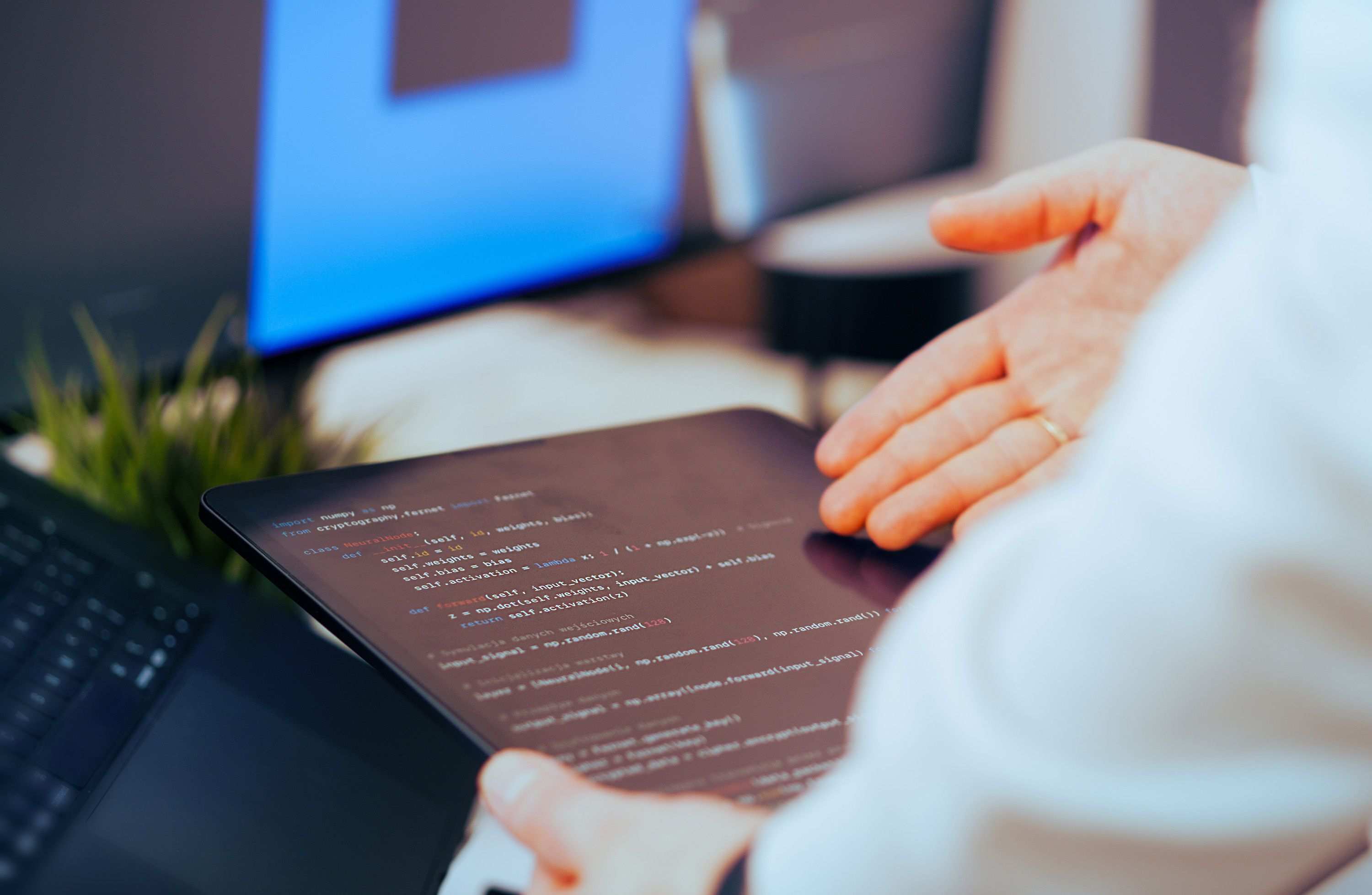 Close view of database query or schema work on a monitor, software developer analyzing code in a modern office workspace